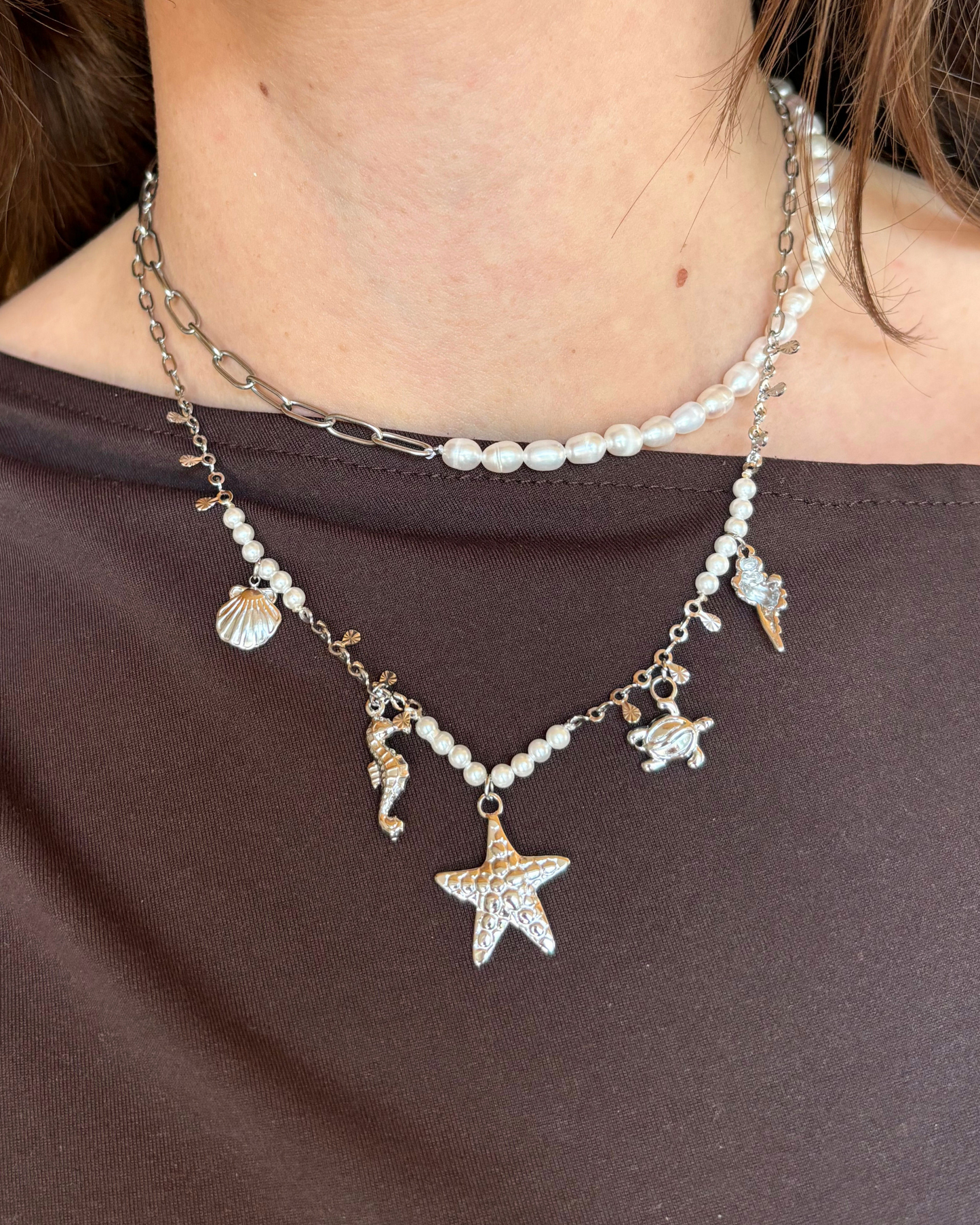 Bedelketting met zeedieren en parels