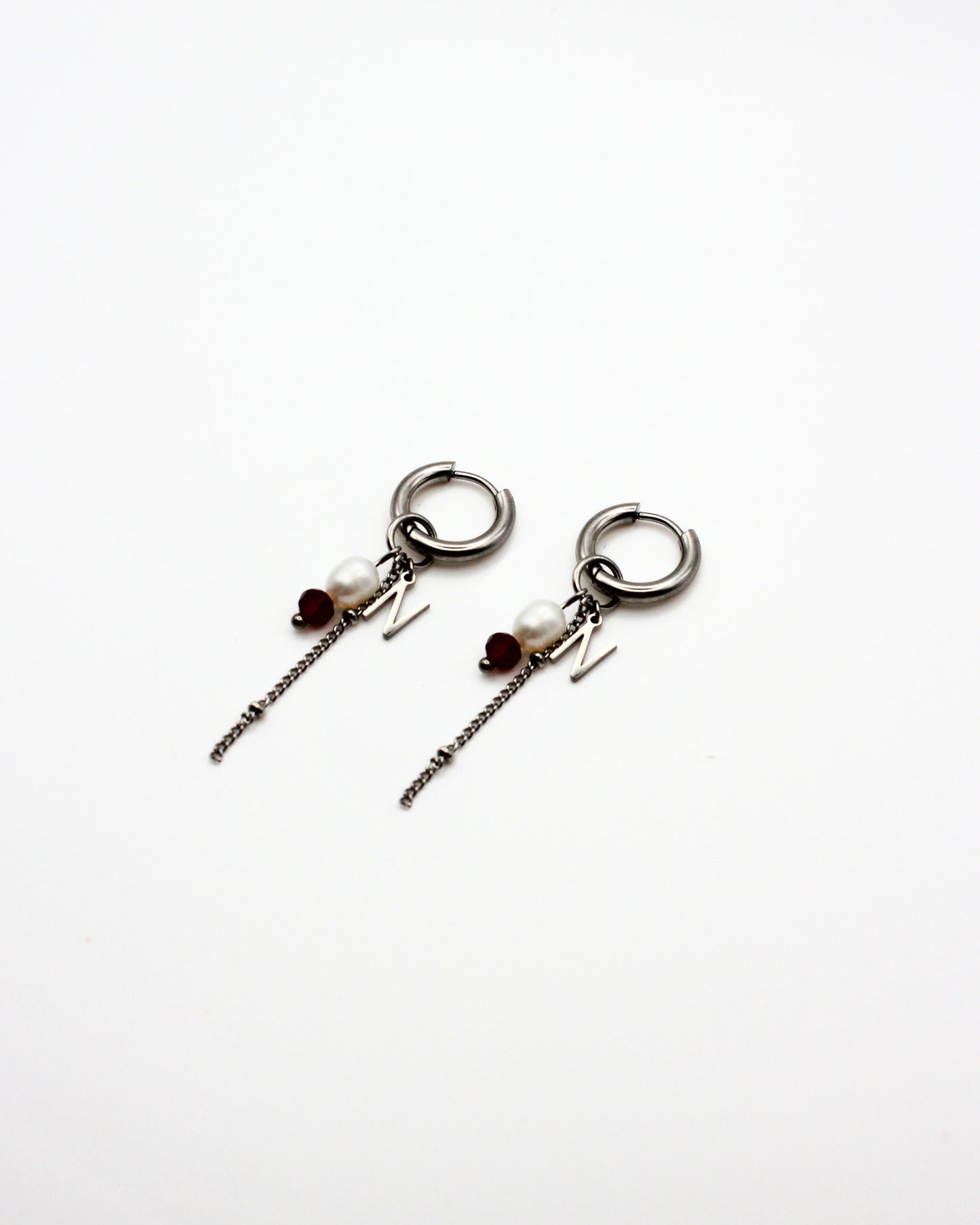 Red earrings with letter
