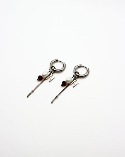 Red earrings with letter